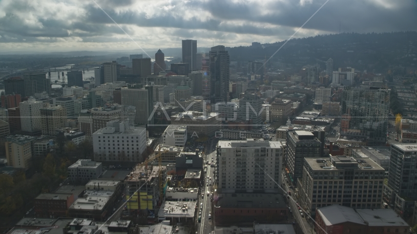 Downtown Portland city buildings on a cloudy day, Oregon Aerial Stock Photo AX153_046.0000200F | Axiom Images