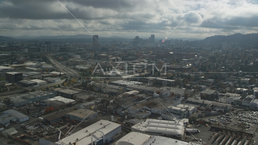 Warehouse buildings and a view of Downtown Portland, Oregon Aerial Stock Photo AX153_066.0000352F | Axiom Images