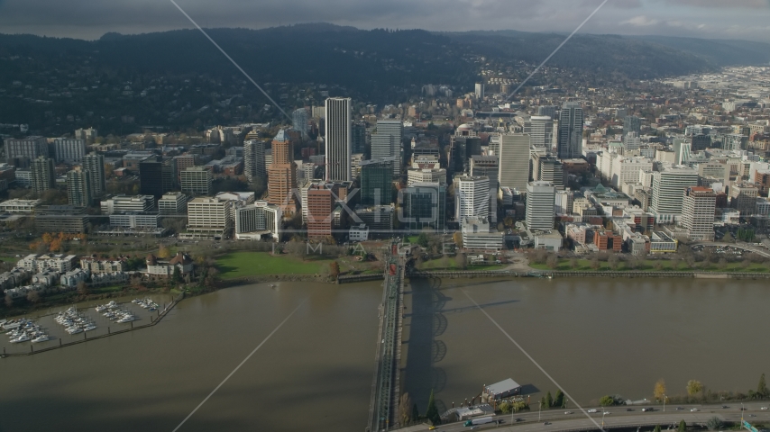 Downtown Portland skyscrapers across the Hawthorne Bridge and the Willamette River, Oregon Aerial Stock Photo AX153_083.0000281F | Axiom Images