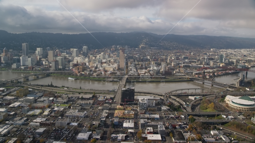 The Burnside Bridge and skyscrapers in Downtown Portland, Oregon Aerial Stock Photo AX153_104.0000091F | Axiom Images