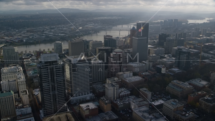 Skyscrapers near bridges spanning the Willamette River in Downtown Portland, Oregon Aerial Stock Photo AX153_110.0000000F | Axiom Images