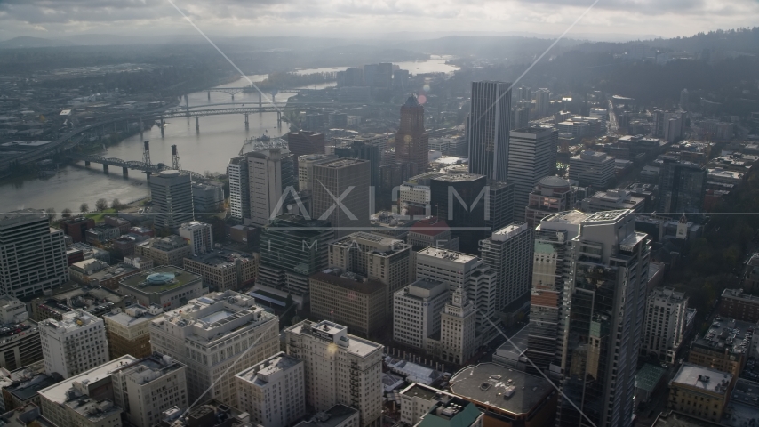 Skyscrapers beside bridges spanning the Willamette River in Downtown Portland, Oregon Aerial Stock Photo AX153_110.0000174F | Axiom Images