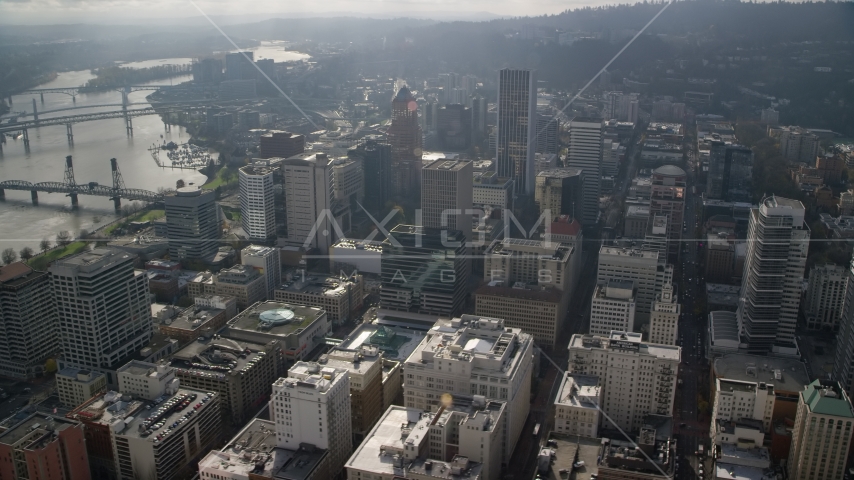 Skyscrapers near bridges and the Willamette River in Downtown Portland, Oregon Aerial Stock Photo AX153_110.0000289F | Axiom Images