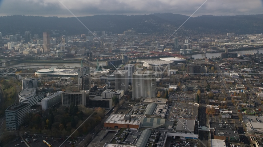 Convention Center, office buildings and Moda Center with Downtown Portland, Oregon in the background Aerial Stock Photo AX153_111.0000135F | Axiom Images