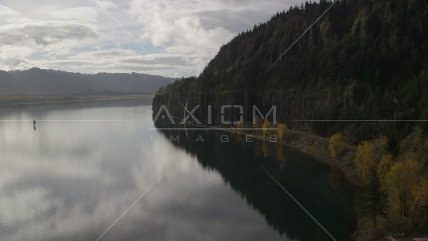 Towering cliffs and waterfall in Columbia River Gorge, Washington Aerial Stock Photo AX154_009.0000000F | Axiom Images