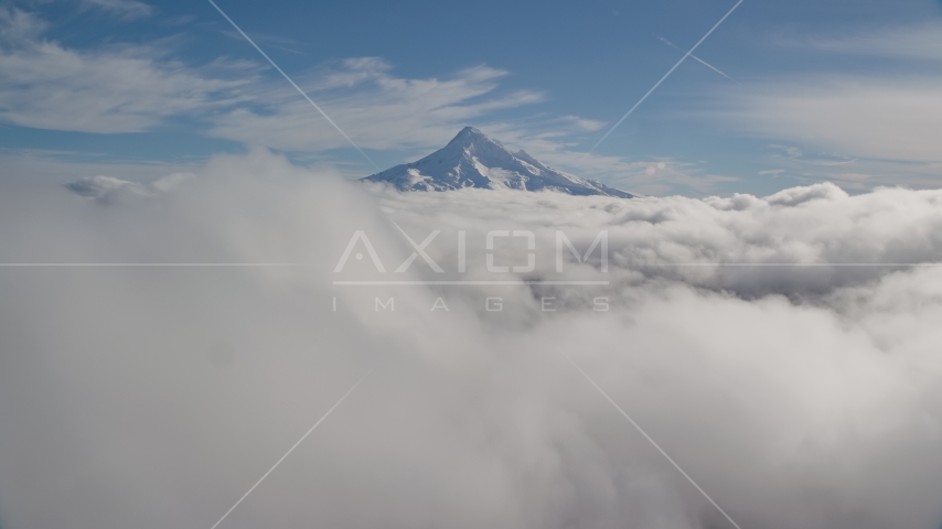 A thick cloud layer around snowy Mount Hood, Cascade Range, Oregon Aerial Stock Photo AX154_062.0000000F | Axiom Images