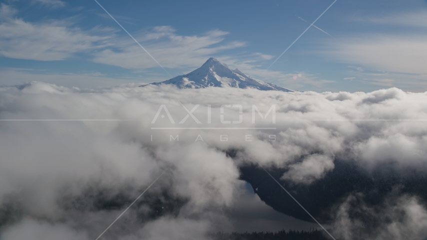 Above clouds near snowy Mount Hood, Cascade Range, Oregon Aerial Stock Photo AX154_063.0000000F | Axiom Images