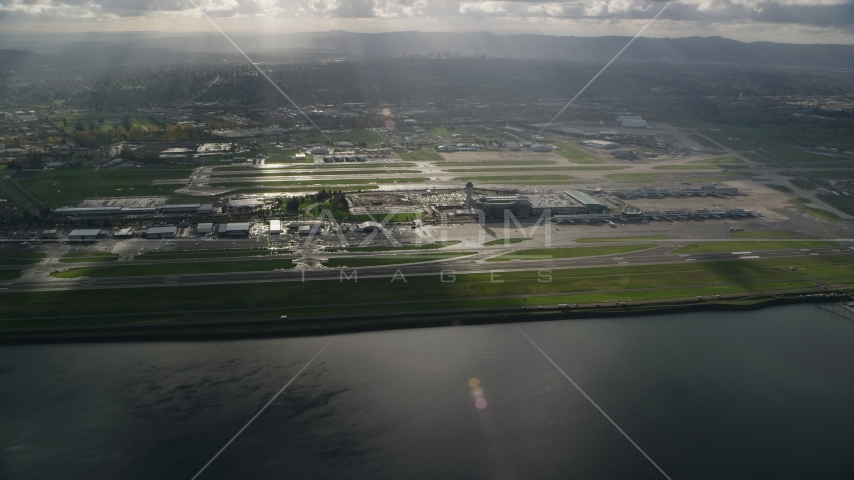 Godrays shining down on the Portland International Airport in Oregon Aerial Stock Photo AX154_220.0000072F | Axiom Images