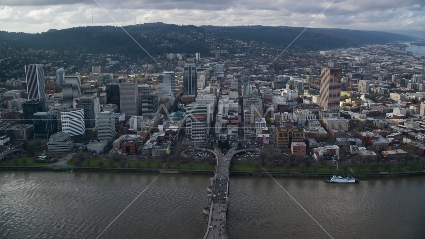 Skyscrapers by the river in Downtown Portland, Oregon, seen from across the Morrison Bridge on the Willamette River Aerial Stock Photo AX154_236.0000172F | Axiom Images