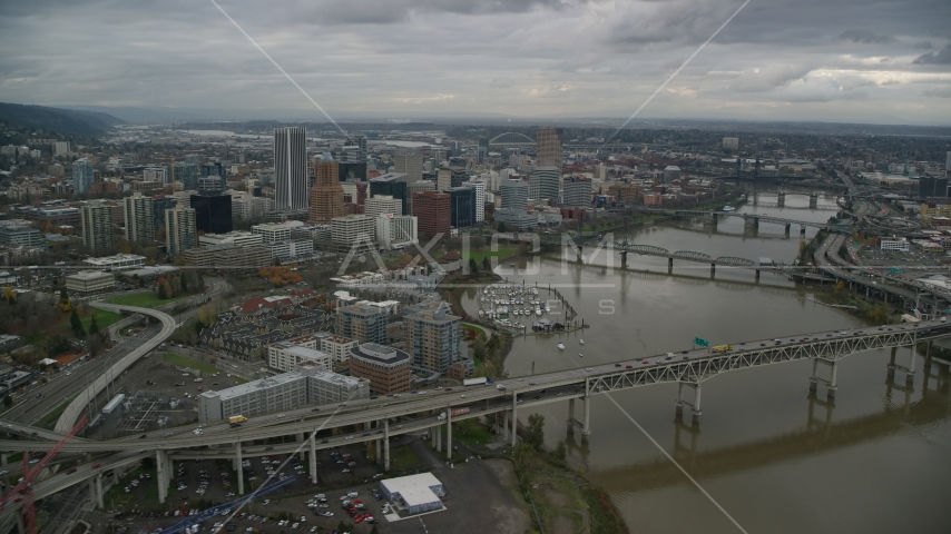 Marquam Bridge and Riverplace Marina near skyscrapers in Downtown Portland, Oregon Aerial Stock Photo AX155_049.0000308F | Axiom Images