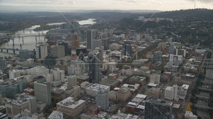 Downtown Portland cityscape with Willamette River behind it in Oregon Aerial Stock Photo AX155_101.0000295F | Axiom Images