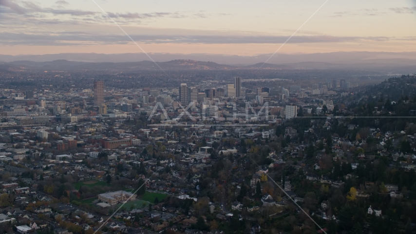 Downtown Portland at sunset, seen from hillside houses in Northwest Portland, Oregon Aerial Stock Photo AX155_141.0000349F | Axiom Images