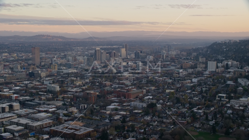 Downtown Portland skyscrapers at sunset, seen from Northwest Portland, Oregon Aerial Stock Photo AX155_142.0000254F | Axiom Images