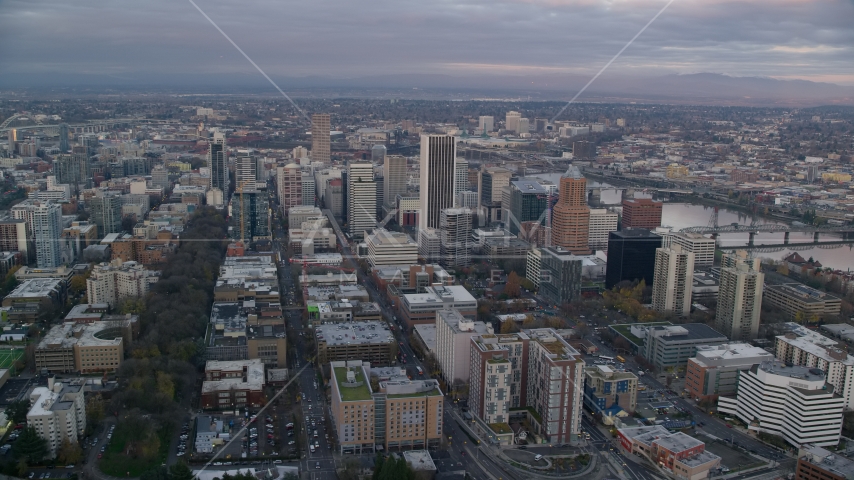 Skyscrapers and city streets near the Willamette River at sunset in Downtown Portland, Oregon Aerial Stock Photo AX155_149.0000211F | Axiom Images