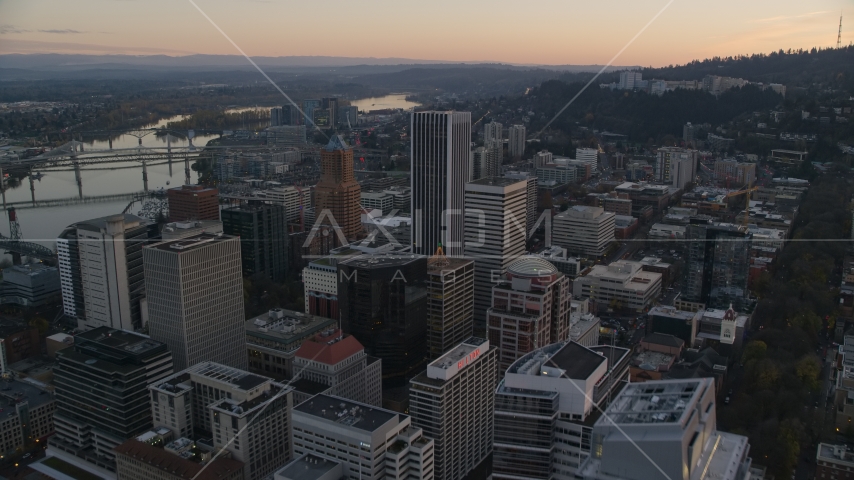 Park Avenue West Tower at sunset near KOIN Center and Wells Fargo Center in Downtown Portland, Oregon Aerial Stock Photo AX155_165.0000206F | Axiom Images