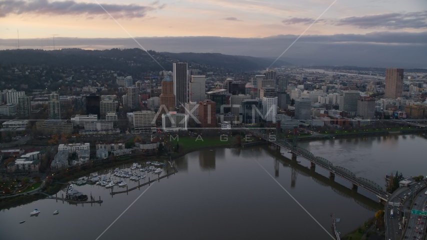 Bridge spanning the Willamette River near Downtown Portland at sunset, Oregon Aerial Stock Photo AX155_172.0000300F | Axiom Images