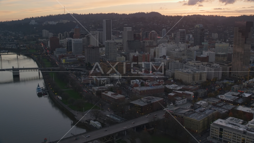 Downtown Portland skyscrapers seen from Willamette River at sunset in Oregon Aerial Stock Photo AX155_186.0000351F | Axiom Images