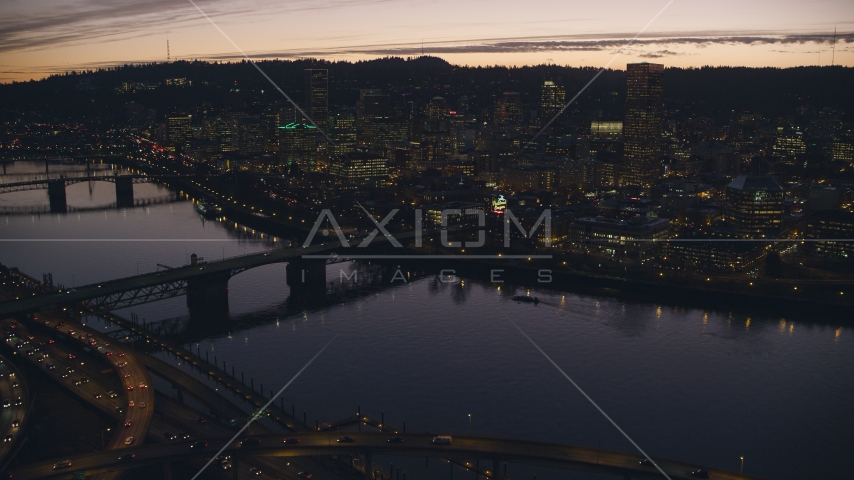 Freeway interchange, Willamette River, Burnside Bridge, and Downtown Portland, Oregon at sunset Aerial Stock Photo AX155_278.0000359F | Axiom Images