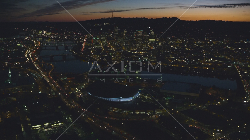 Downtown Portland and Willamette River at night seen from Moda Center in Oregon Aerial Stock Photo AX155_308.0000296F | Axiom Images