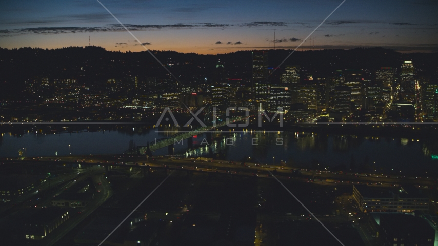 Downtown skyscrapers across Hawthorne Bridge, Willamette River, Portland, Oregon, night Aerial Stock Photo AX155_320.0000138F | Axiom Images