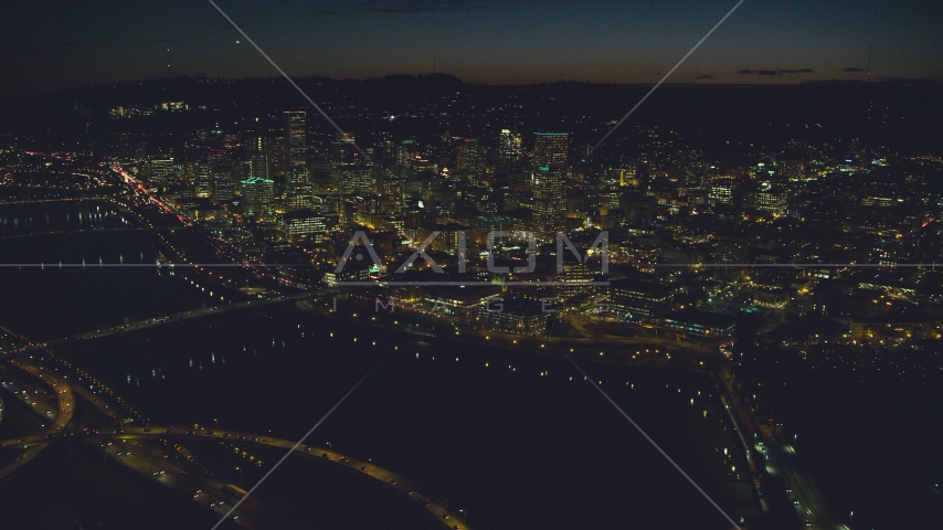 US Bancorp Tower, White Stag sign across Willamette River, Burnside Bridge, Steel Bridge, night, Downtown Portland, Oregon Aerial Stock Photo AX155_362.0000258F | Axiom Images