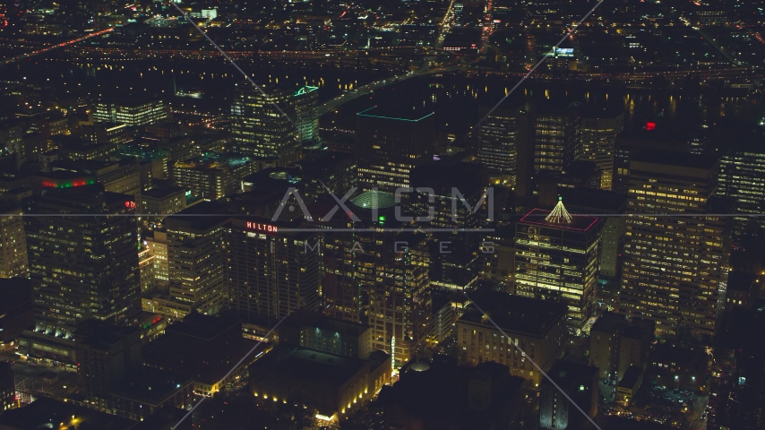 High-rises and skyscrapers by the Willamette River at night in Downtown Portland, Oregon Aerial Stock Photo AX155_391.0000102F | Axiom Images