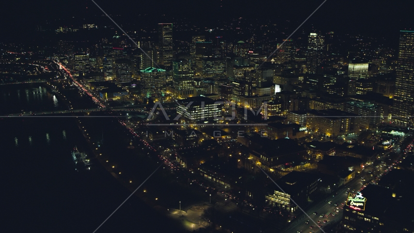 Skyscrapers, high-rises, and White Stag sign seen from Burnside Bridge at night, Downtown Portland, Oregon Aerial Stock Photo AX155_431.0000359F | Axiom Images