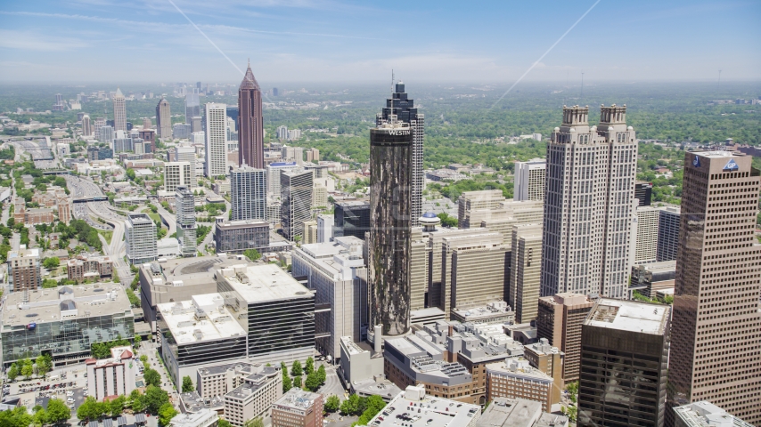 Office buildings near skyscrapers, Westin Peachtree Plaza Hotel, Downtown Atlanta, Georgia Aerial Stock Photo AX36_006.0000025F | Axiom Images