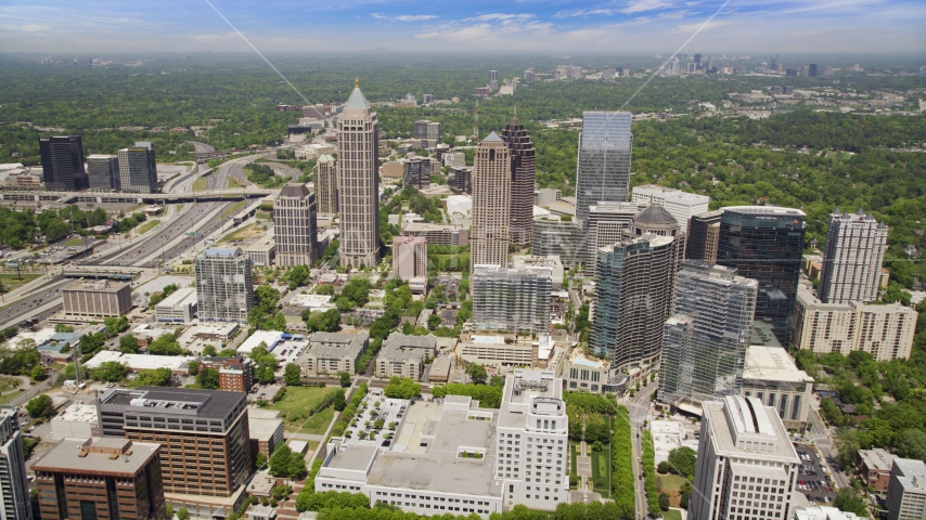 Office buildings with skyscrapers in the distance, Midtown Atlanta, Georgia Aerial Stock Photo AX36_011.0000208F | Axiom Images