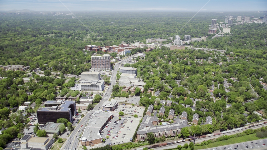 Office buildings and wooded areas, skyscrapers in the distance, Buckhead, Georgia Aerial Stock Photo AX36_046.0000119F | Axiom Images