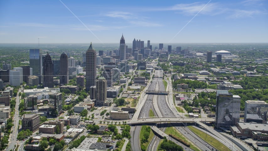 Downtown Connector toward Midtown Atlanta skyscrapers, hazy, Georgia Aerial Stock Photo AX36_086.0000141F | Axiom Images