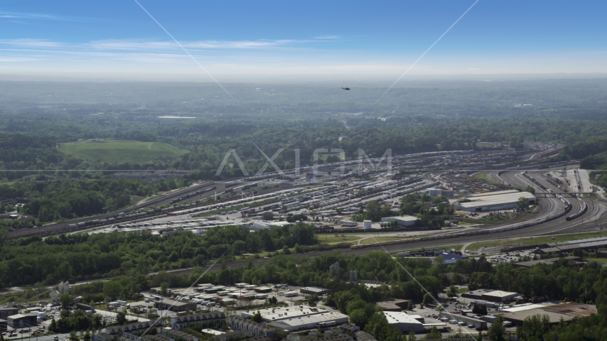 Train yard surrounded by green trees, Atlanta, Georgia Aerial Stock Photo AX37_085.0000025F | Axiom Images