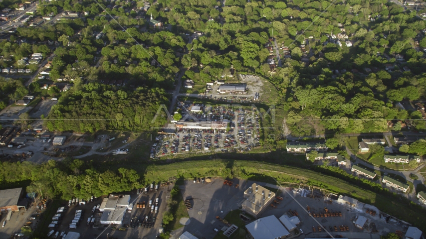 Looking down on a junkyard, trees, West Atlanta, Georgia Aerial Stock Photo AX39_001.0000124F | Axiom Images