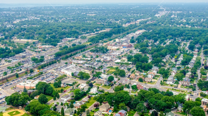 Train station and office buildings in Massapequa, Long Island, New York Aerial Stock Photo AXP071_000_0011F | Axiom Images