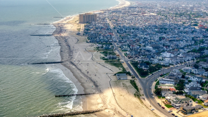 Sunbathers on the beach in Ocean City, New Jersey Aerial Stock Photo AXP071_000_0023F | Axiom Images