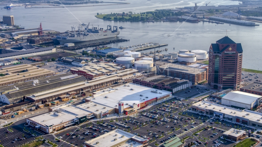 Naval ships near Canton Crossing shops and the First Mariner Bank Building in Baltimore, Maryland Aerial Stock Photo AXP073_000_0008F | Axiom Images