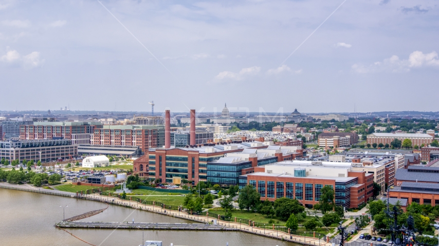 The United States Capitol seen seen from office buildings with smoke stacks in Washington DC Aerial Stock Photo AXP074_000_0004F | Axiom Images