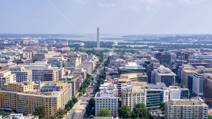 The Washington Monument, White House, and Jefferson Memorial in distance in Washington DC Aerial Stock Photo AXP075_000_0015F | Axiom Images