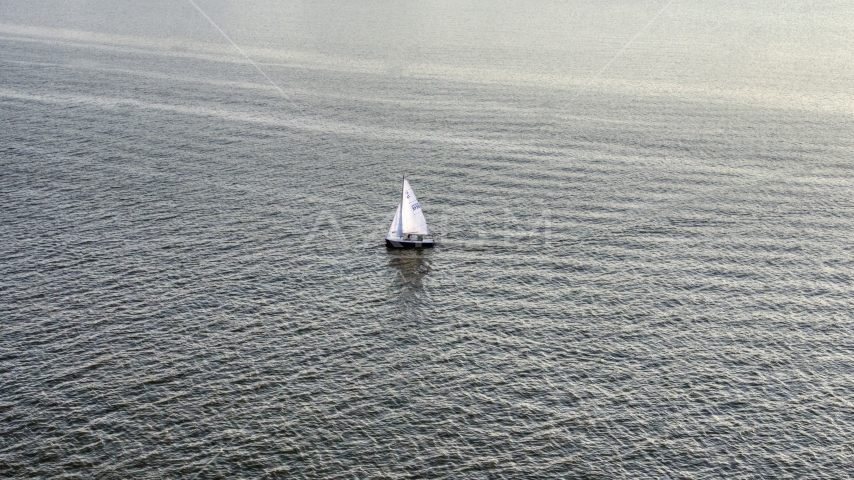 A sailboat on the Potomac River, Washington, D.C., sunset Aerial Stock Photo AXP076_000_0004F | Axiom Images