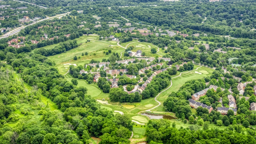 Town houses on Fairway Hills Golf Course in Columbia, Maryland Aerial Stock Photo AXP078_000_0001F | Axiom Images