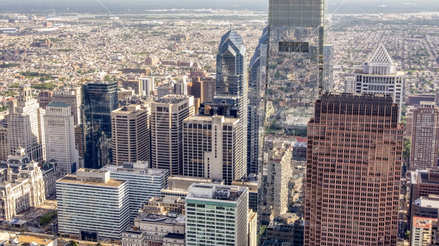 Comcast Center towering over Downtown Philadelphia skyscrapers, Pennsylvania Aerial Stock Photo AXP079_000_0004F | Axiom Images