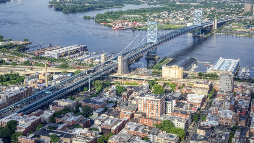 The Benjamin Franklin Bridge spanning the Delaware River between Philadelphia, Pennsylvania and Camden, New Jersey Aerial Stock Photo AXP079_000_0011F | Axiom Images