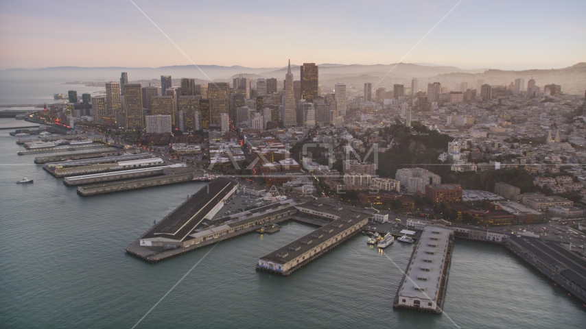 Piers by Coit Tower, and Downtown San Francisco skyscrapers, California, twilight Aerial Stock Photo DCSF07_081.0000283 | Axiom Images