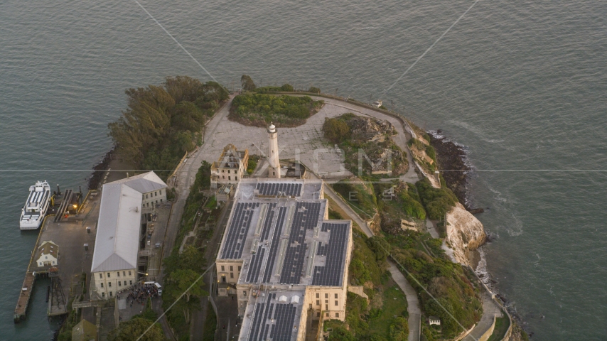 The Alcatraz lighthouse and main building, San Francisco, California, sunset Aerial Stock Photo DCSF10_024.0000245 | Axiom Images