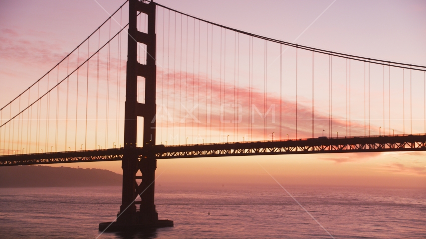 A tower and light traffic on the Golden Gate Bridge, San Francisco, California, twilight Aerial Stock Photo DCSF10_046.0000028 | Axiom Images