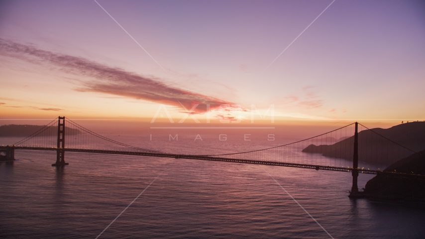 A view of the Golden Gate Bridge with clouds in the distance lit by the twilight, San Francisco, California Aerial Stock Photo DCSF10_051.0000000 | Axiom Images