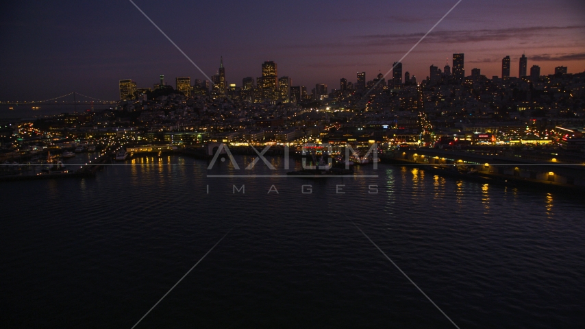 Fisherman's Wharf, with downtown skyline in the background, San Francisco, California, twilight Aerial Stock Photo DCSF10_055.0000451 | Axiom Images