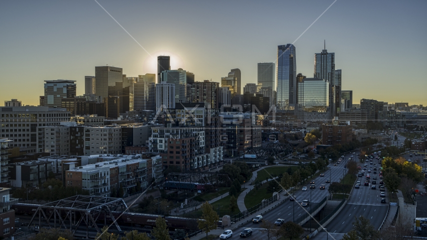 Skyscrapers of the city's skyline at sunrise, seen from busy street in Downtown Denver, Colorado Aerial Stock Photo DXP001_000111 | Axiom Images