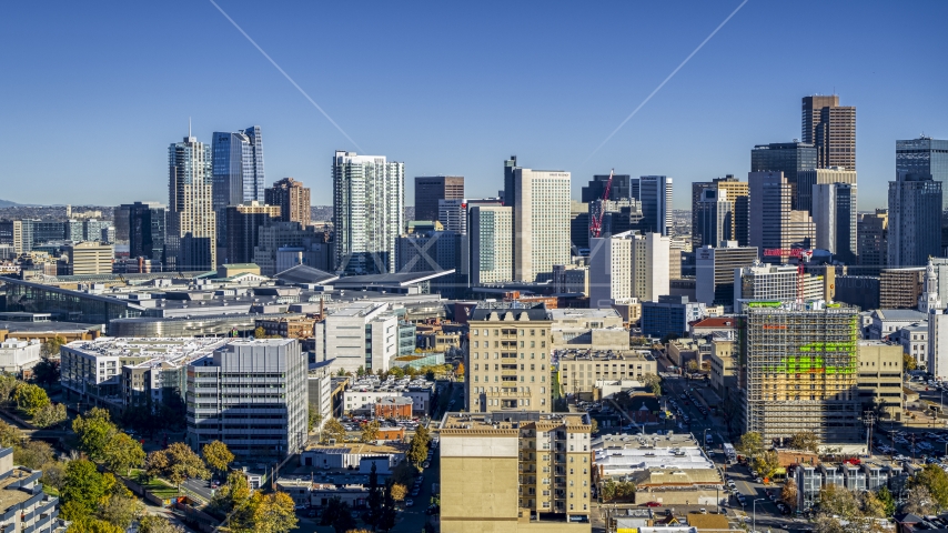 Skyscrapers in the city's skyline behind office buildings, Downtown Denver, Colorado Aerial Stock Photo DXP001_000128 | Axiom Images