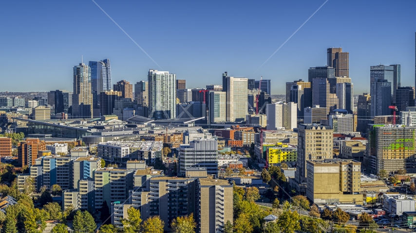 Skyscrapers in the city's skyline behind apartment and office buildings, Downtown Denver, Colorado Aerial Stock Photo DXP001_000129 | Axiom Images